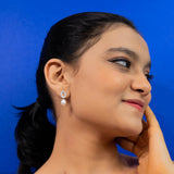 Baguette cut earrings with pearl droplets white gold