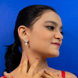 Baguette cut earrings with pearl droplets white gold