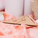 Star Shaped Pearl Drop Earrings in Rose gold