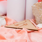 Star Shaped Pearl Drop Earrings in Rose gold