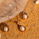 Caged pearl pendant set rose gold